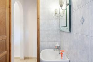 a bathroom with a sink and a mirror at Studios Asterias 4 in Astypalaia +20 photos
