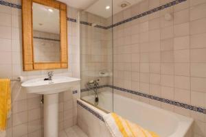 a bathroom with a sink and a bath tub at Plana Morro in Pollença +17 photos