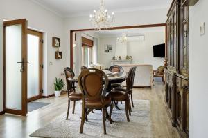 a dining room with a table and chairs at Vermarl - Viana do Castelo in Linhares de Cima