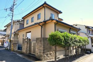 a house with a fence in front of it at 心宿 伏見稲荷 in Kyoto