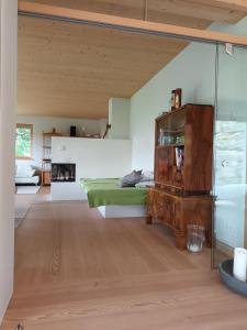 a bedroom with a bed and a fireplace at Haus am Teich mit privater Sauna in Sankt Leonhard bei Freistadt