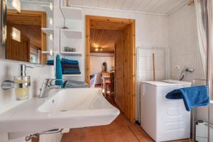 a bathroom with a sink and a toilet at Dat Haddehuus in Wangerland +66 photos