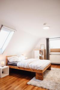 a bedroom with a large bed in a attic at Idylische Ferienunterkunft in Heitersheim
