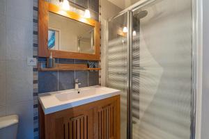 a bathroom with a sink and a shower at Gîtes Ker Mané in Erdeven +39 photos