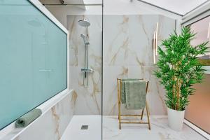 a bathroom with a shower and a plant at Casa Belavista in Gaula +41 photos