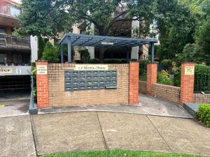 a brick wall with a sign that reads nashville shuttle at The Castle in Castle Hill