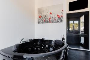 a room with a table with a car on it at Suite Black and White in Otranto