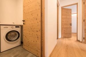 a laundry room with a washer and dryer at Apt Lara Siela in Ortisei