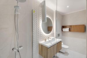 a bathroom with a sink and a shower with a mirror at Villa Spinnaker Playa in Puerto de Santiago +29 photos