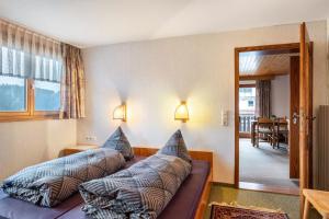 a room with a couch with pillows on it at Haus Irmgard in Lenzkirch