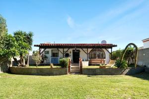 a house with a gazebo in a yard at Casa Luna in Los Caños de Meca