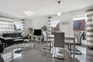 a living room with a couch and a table at Fewo Am Otterbach in Jockgrim