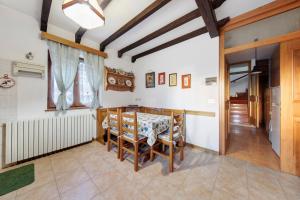a dining room with a table and chairs at Villa Maria Auronzo in Auronzo di Cadore