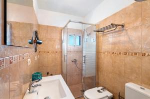 a bathroom with a shower and a sink and a toilet at Casa Maruca 1 in Valverde +19 photos