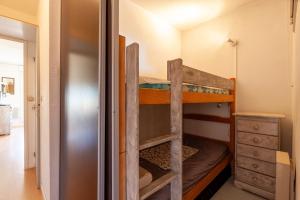 a bunk bed in a room with a closet at Studio Sanary in Sanary-sur-Mer