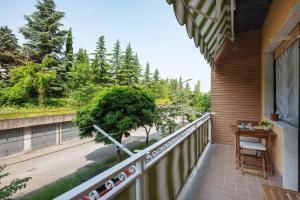 a balcony of a house with a table and a fence at La Casa Della Gioia - Serravalle in Serravalle Scrivia