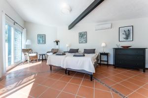 a bedroom with a bed in a room at Holiday Villa Torrenueva in La Cala de Mijas