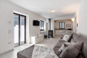 a living room with a couch and a table at Borgo Vico in Verceia
