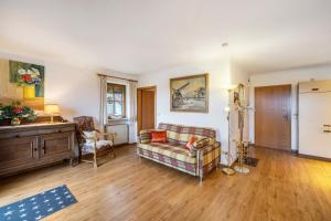 a living room with a couch and a table at Landhaus Kauderer - Wohnung 2 in Waging am See