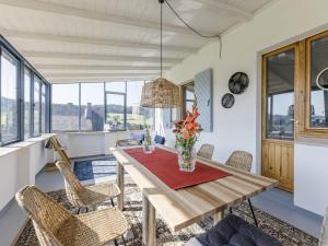 a dining room with a table and chairs at Dorfhaus1953 in Eslohe