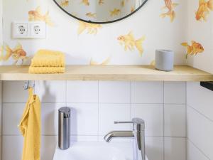 a bathroom with a wooden shelf above a sink at Dorfhaus1953 in Eslohe