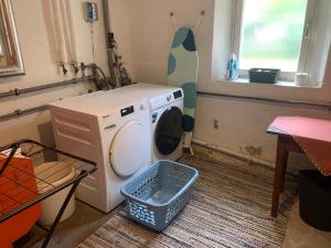 a laundry room with a washing machine and a window at Ferienwohnung Durst 1 in Mayrhofen