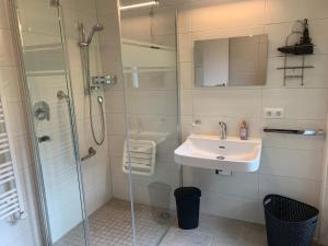 a bathroom with a sink and a shower at Ferienwohnung Durst 1 in Mayrhofen +21 photos