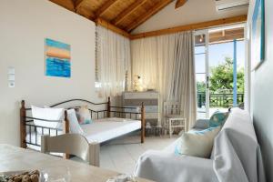 a living room with two chairs and a couch at Niki's Studios Kalymnos in Kalymnos