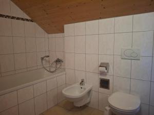 a bathroom with a toilet and a sink at Chalet Martina in Stadl an der Mur +20 photos