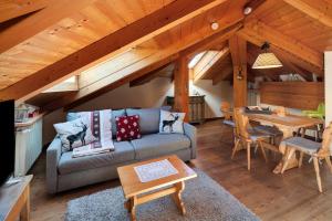 a living room with a couch and a table at Dimora La Rocca in Daiano