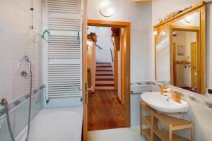 a bathroom with a sink and a shower at Dimora La Rocca in Daiano