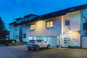 a car parked in front of a house at Ferienwohnung Rheinvorland in Linx