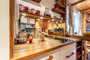 a kitchen with a wooden counter top in a room at Chalet Hüttentraum in Inzell