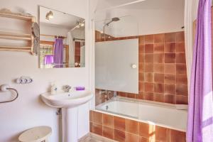 a bathroom with a sink and a toilet and a tub at Ca les Estamenyes in Pollença +17 photos