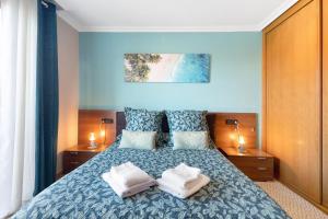a bedroom with a bed with two pillows on it at Ático Beach Sotavento in La Tejita +22 photos