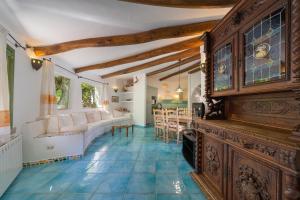 a living room with a couch and a table at Villa Lumaca in Porto Rotondo