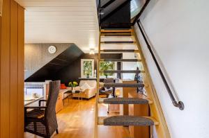 a staircase in a house with a living room at Ferienwohnung Klee 2 in Fedderwarden