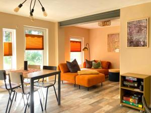 a living room with a couch and a table at Bungalow 314 in Joachimsthal