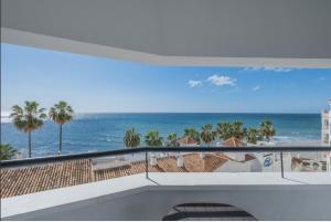 a balcony with a view of the ocean at Flat3-5 Chaparil Beach in Nerja