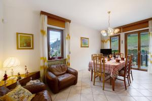 a living room with a table and a couch at Casa Vacanze Gianluca in Aosta