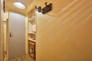 a door leading into a kitchen with a shelf at L'Edelweiss in Saint-Pierre-de-Chartreuse
