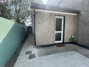 a doorway to a building with a door open at Private Entrance En-suite in Gorey