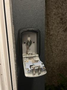 a metal outlet with a key in a wall at Private Entrance En-suite in Gorey