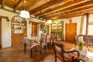 a dining room with a table and chairs at Cal Barral in Ansobell