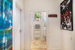 a bathroom with a toilet and a sink at Ferienwohnung Ederweg in Wahlershausen +13 photos
