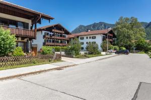 a street in a town with houses and a car at Studio Bergblick in Inzell