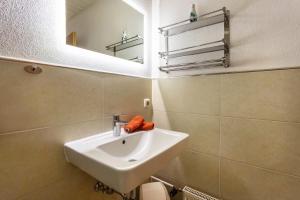 a bathroom with a sink and a mirror at Studio Bergblick in Inzell