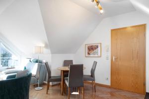 a dining room with a table and chairs at Ferienwohnung Tannenblick 7-5 in Oberhof