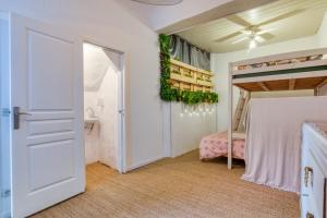 a bedroom with a bunk bed and a door at Agde Heritage, No. 16 in Agde