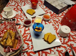 a table with two plates of food on it at Chambre D'hôtes À 2 Pas Des Plages in Notre-Dame-de-Riez